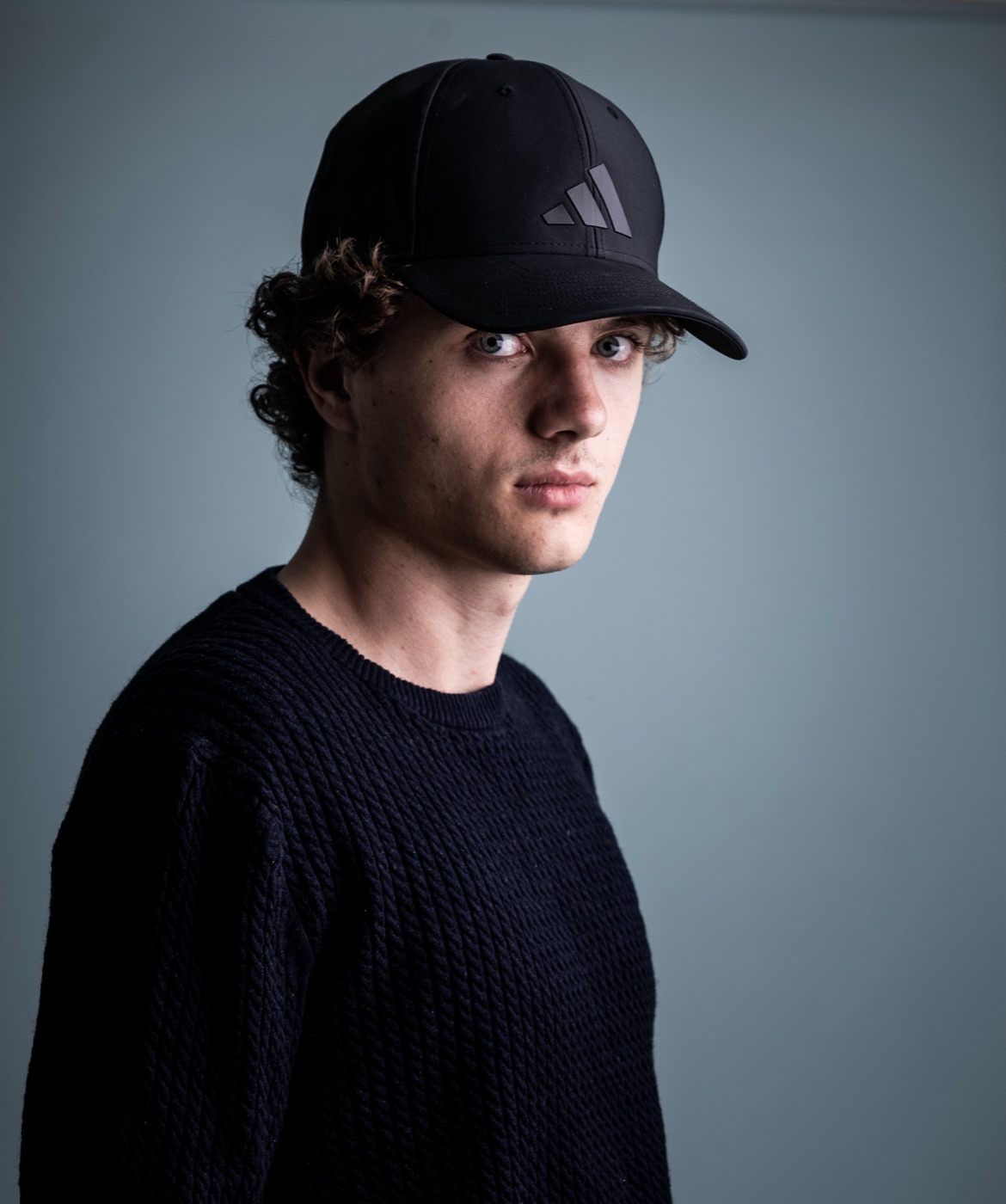 William Jannert: casual portrait in a cap and sweater
