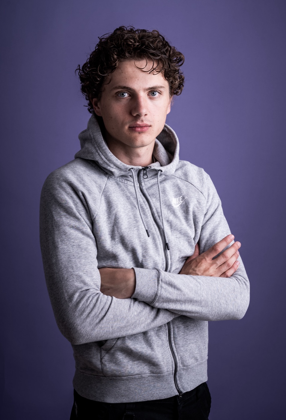 William Jannert: casual portrait in a grey hoodie