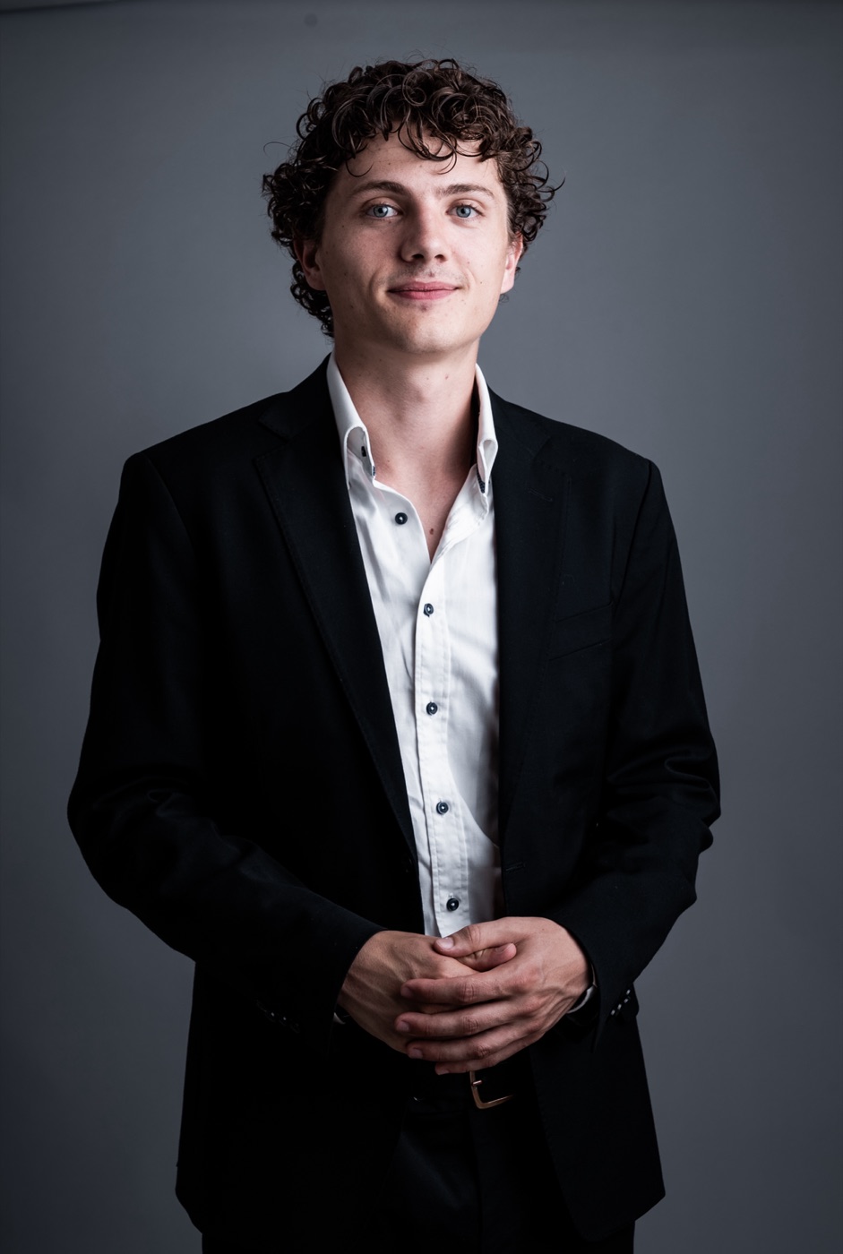 William Jannert: studio portrait in a black suit